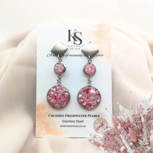 Handmade with care, these earrings feature crushed freshwater pearls in luminous blush pink, set within 8 mm and 16 mm stainless steel bezels