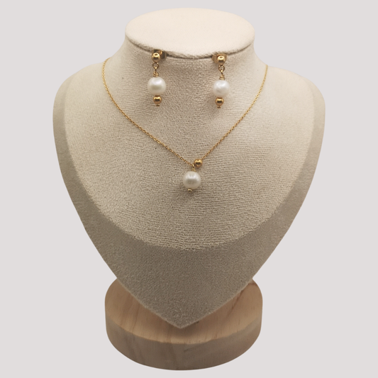 Stainless steel Gold Plated Pearl necklace and earrings set on a mannequin bust with a plain background