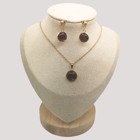 Crushed Red Garnet Jewelry set with necklace and earrings on a mannequin bust.