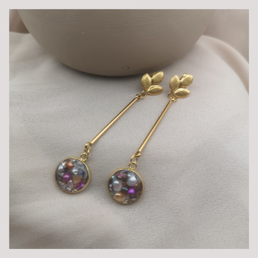 Gols plated stainless steel dangle earrings with crushed freshwater pearls.