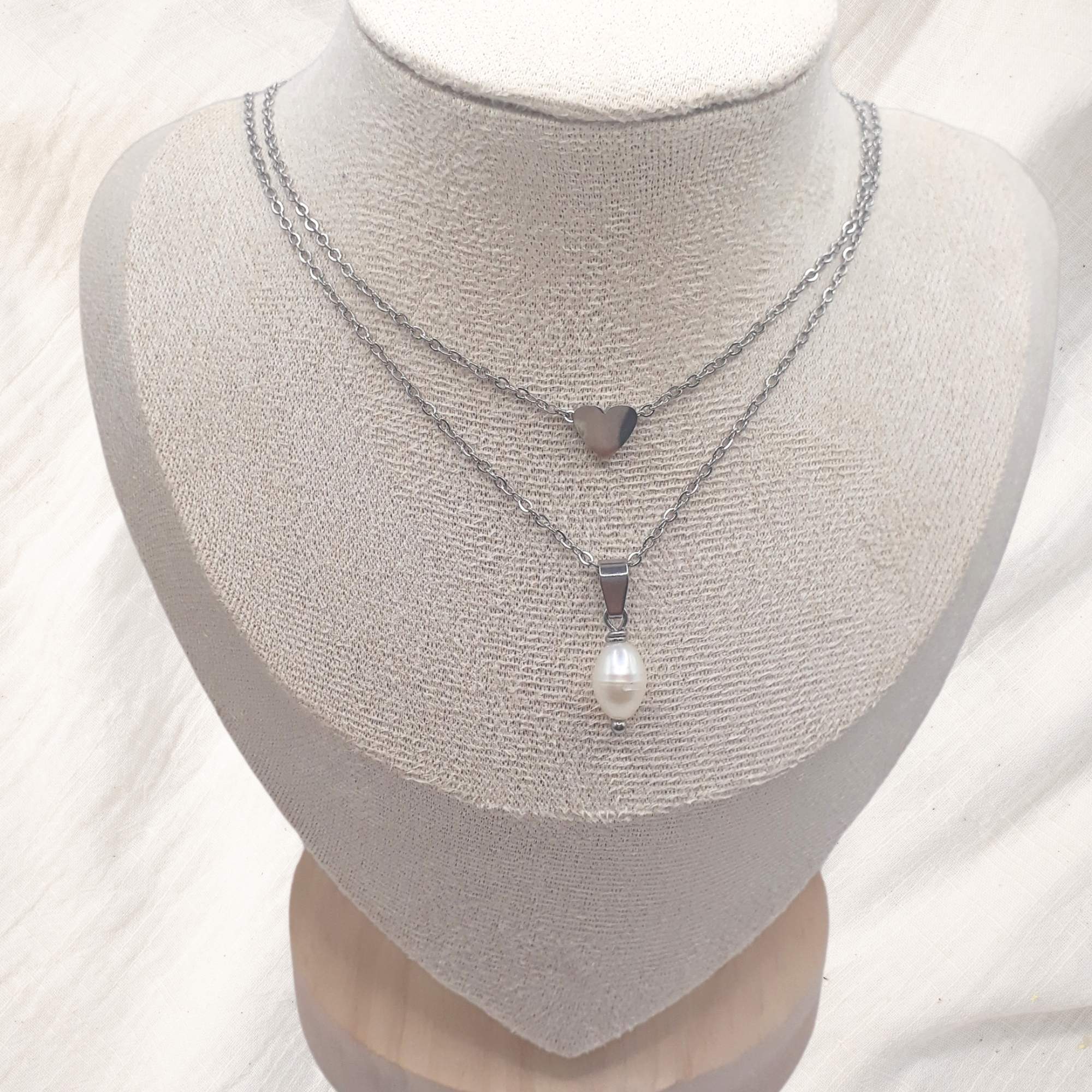 Freshwater pearl necklace collection featuring pendants, chokers, and layered designs.