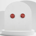 12mm stainless steel stud earrings with crushed natural red coral sealed in glossy resin bezel setting