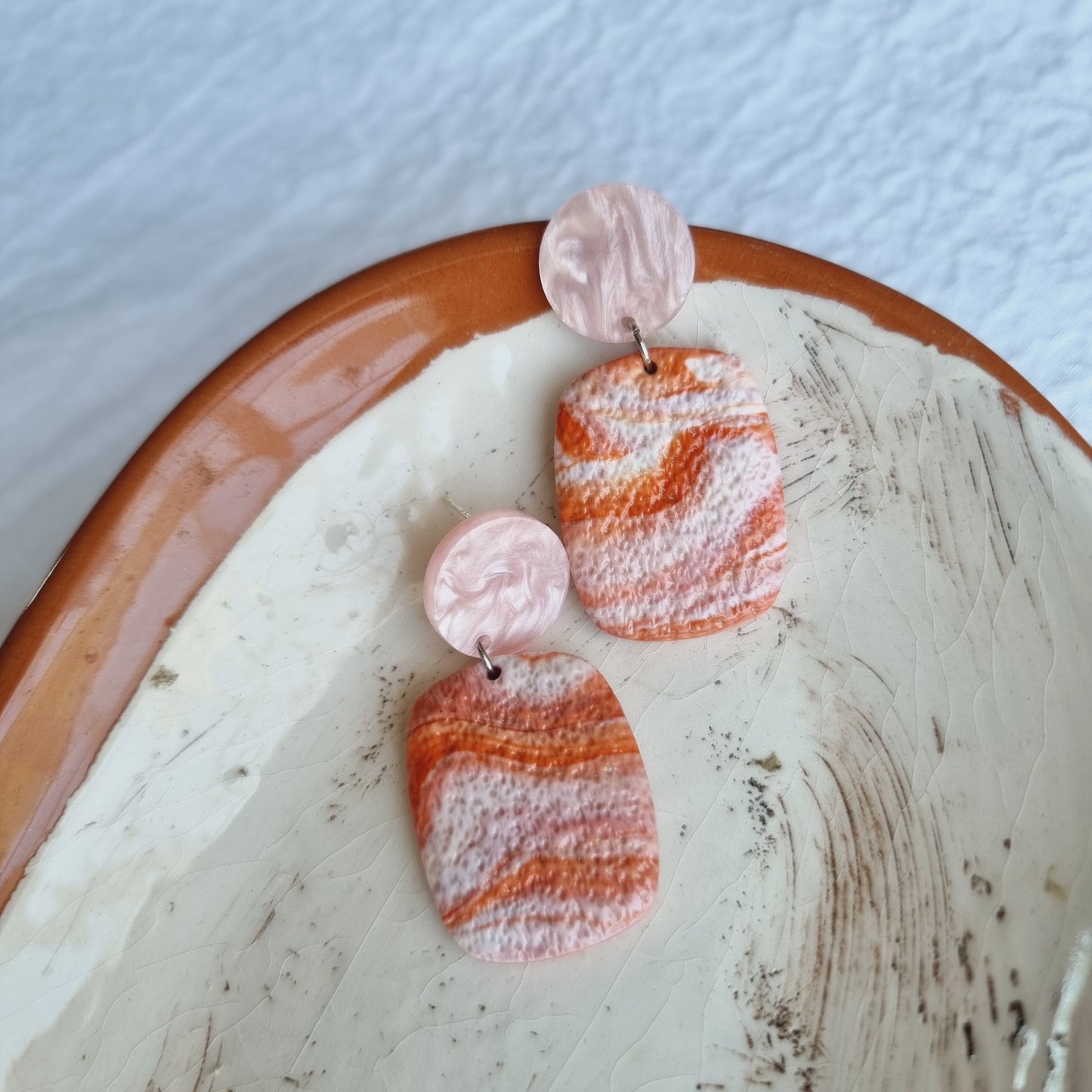 These unique, handmade polymer clay earrings are the perfect accessory to complete any look.