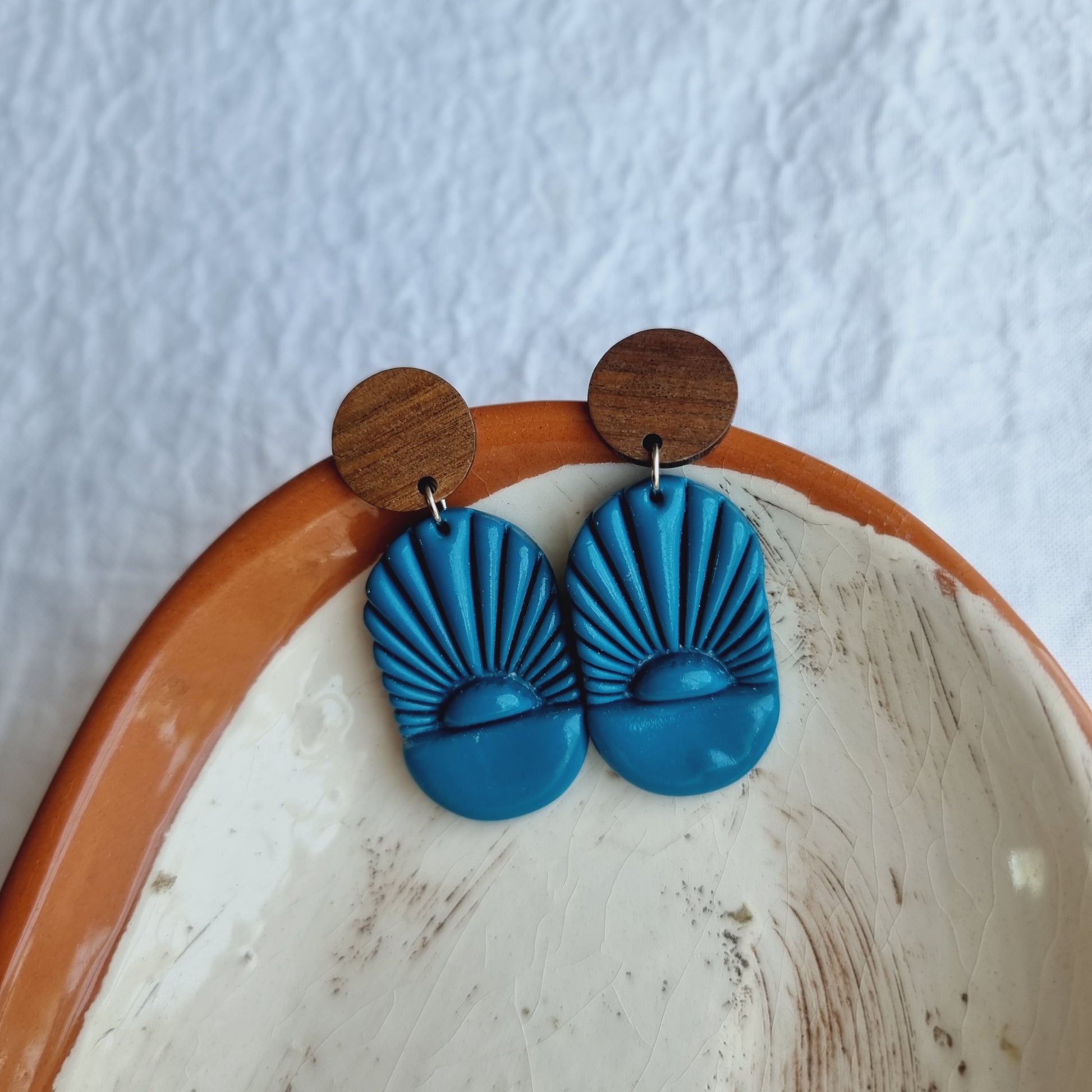 Unique handmade Teal Blue Oval Polymer Clay Earrings! These stunning earrings are a true work of art, crafted with care and precision.