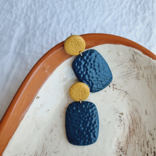 Turn heads with these handmade, conversation-starting earrings. Crafted from a unique mix of mustard and dark green polymer clay