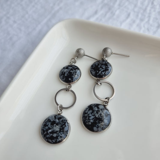 Elevate your style with our handmade Raw Snowflake Obsidian Dangle Earrings.