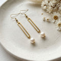 Natural 7mm white freshwater pearl gold plated 304 stainless steel dangle earrings