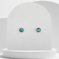 7mm stainless steel stud earrings with crushed natural turquoise gemstones sealed in glossy resin bezel setting