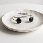 Handmade 304 stainless steel cuff bangle with natural Star Stone 12mm bezel settings and clear resin finish.