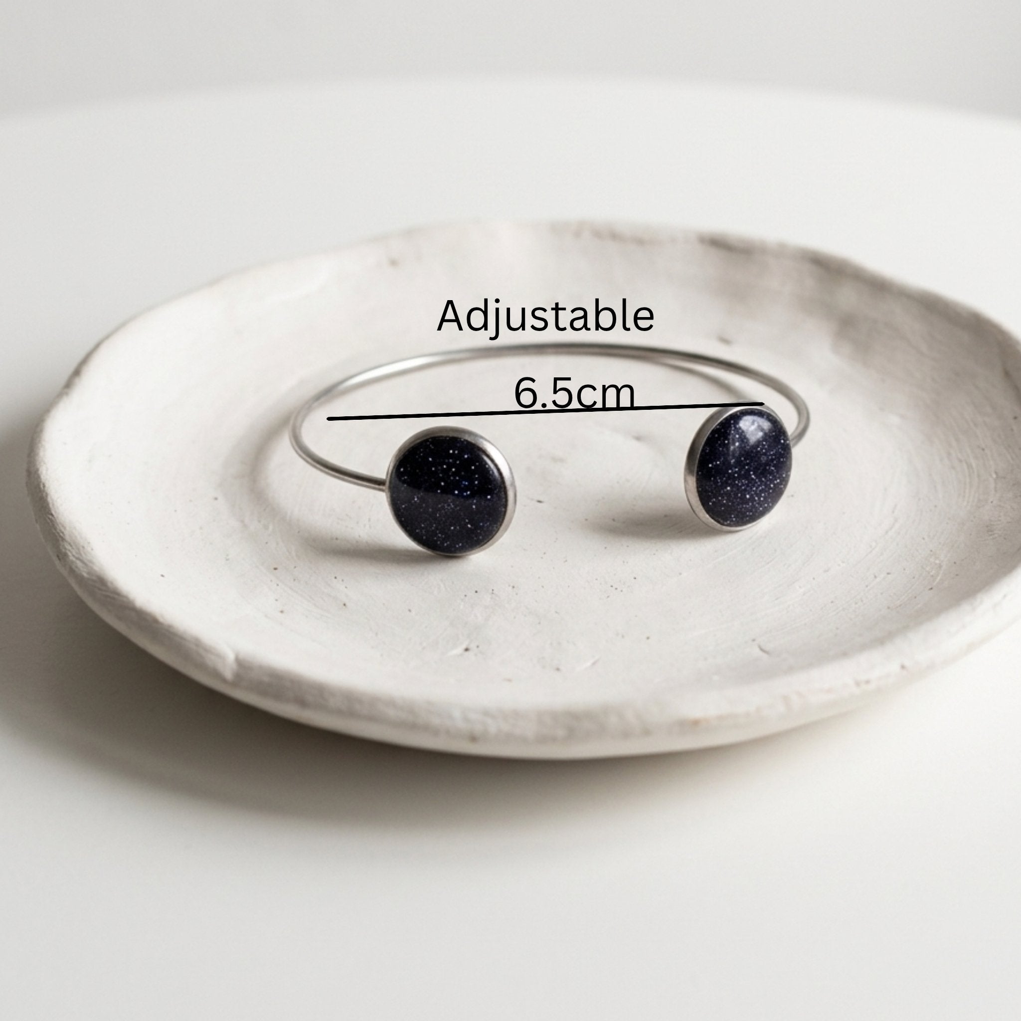 Handmade 304 stainless steel cuff bangle with natural Star Stone 12mm bezel settings and clear resin finish.
