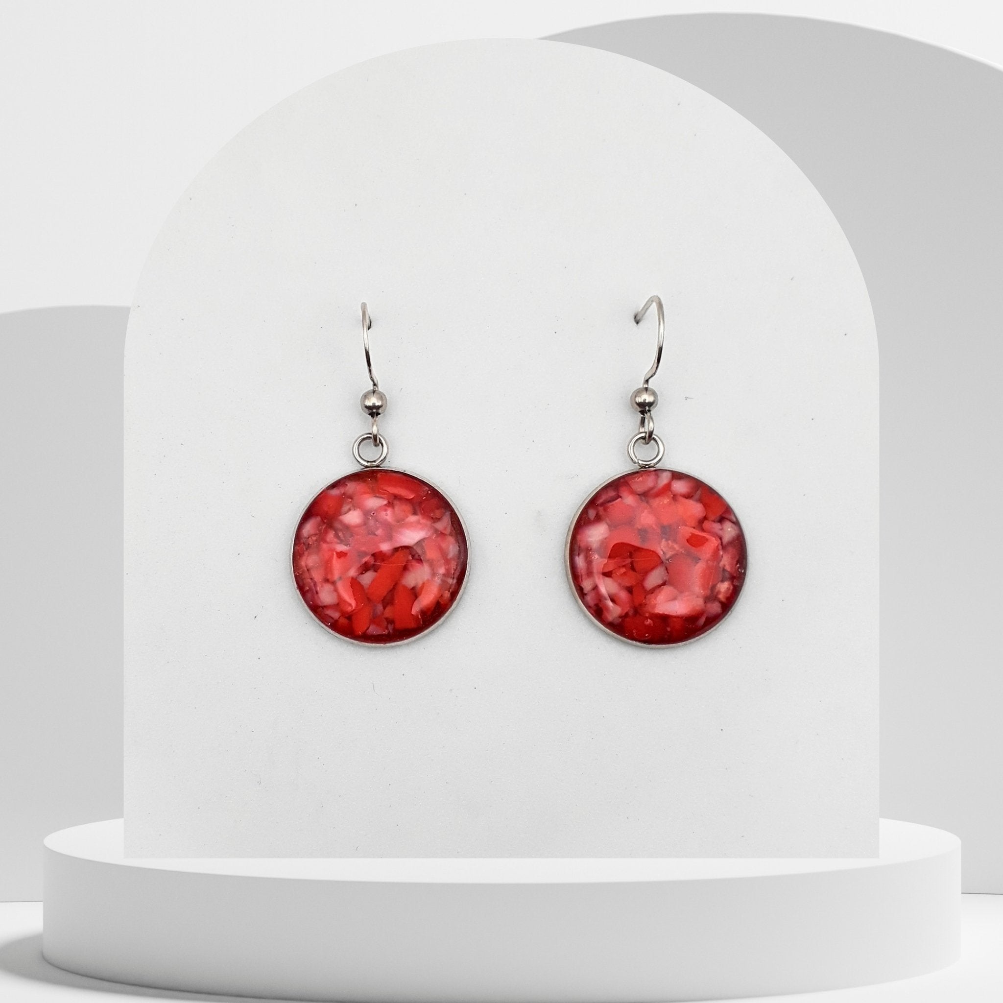 18mm stainless steel drop earrings with crushed natural red coral sealed in resin and finished with shepherd ear hooks
