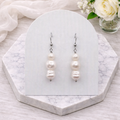 Triple white freshwater pearl drop earrings