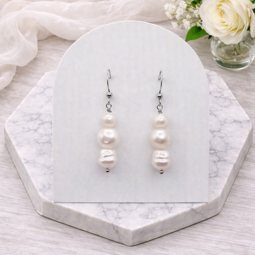 Triple white freshwater pearl drop earrings