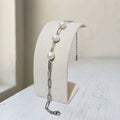 Handcrafted stainless steel bracelet featuring three beautiful 7mm white off-round freshwater pearls - Kiooinsitu