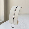 Handcrafted with stainless steel, this bracelet features natural freshwater pearls (7mm and 4mm) paired with sleek black onyx beads - Kiooinsitu