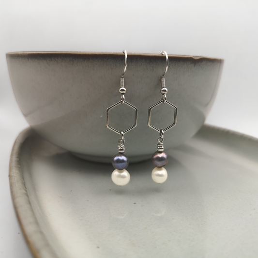 The Twilight Glow earrings combine geometric elegance with the timeless beauty of pearls