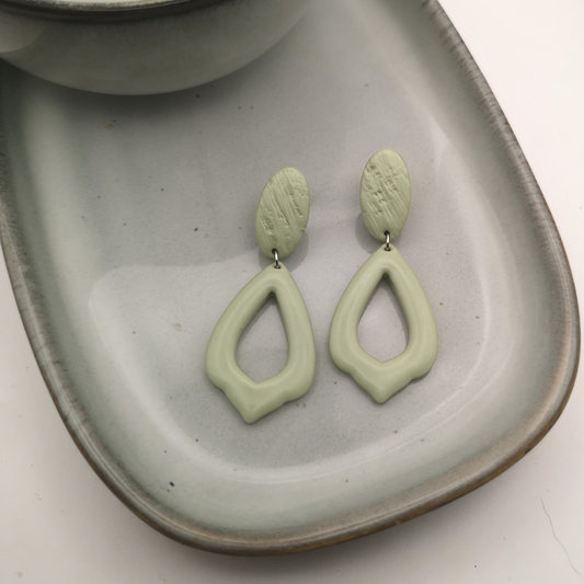 The Sage Aura earrings bring a serene, modern elegance to your accessory collection.