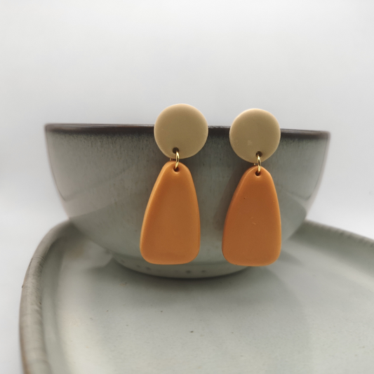 The Amber Dune earrings embody warm, earthy elegance with a modern minimalist edge.