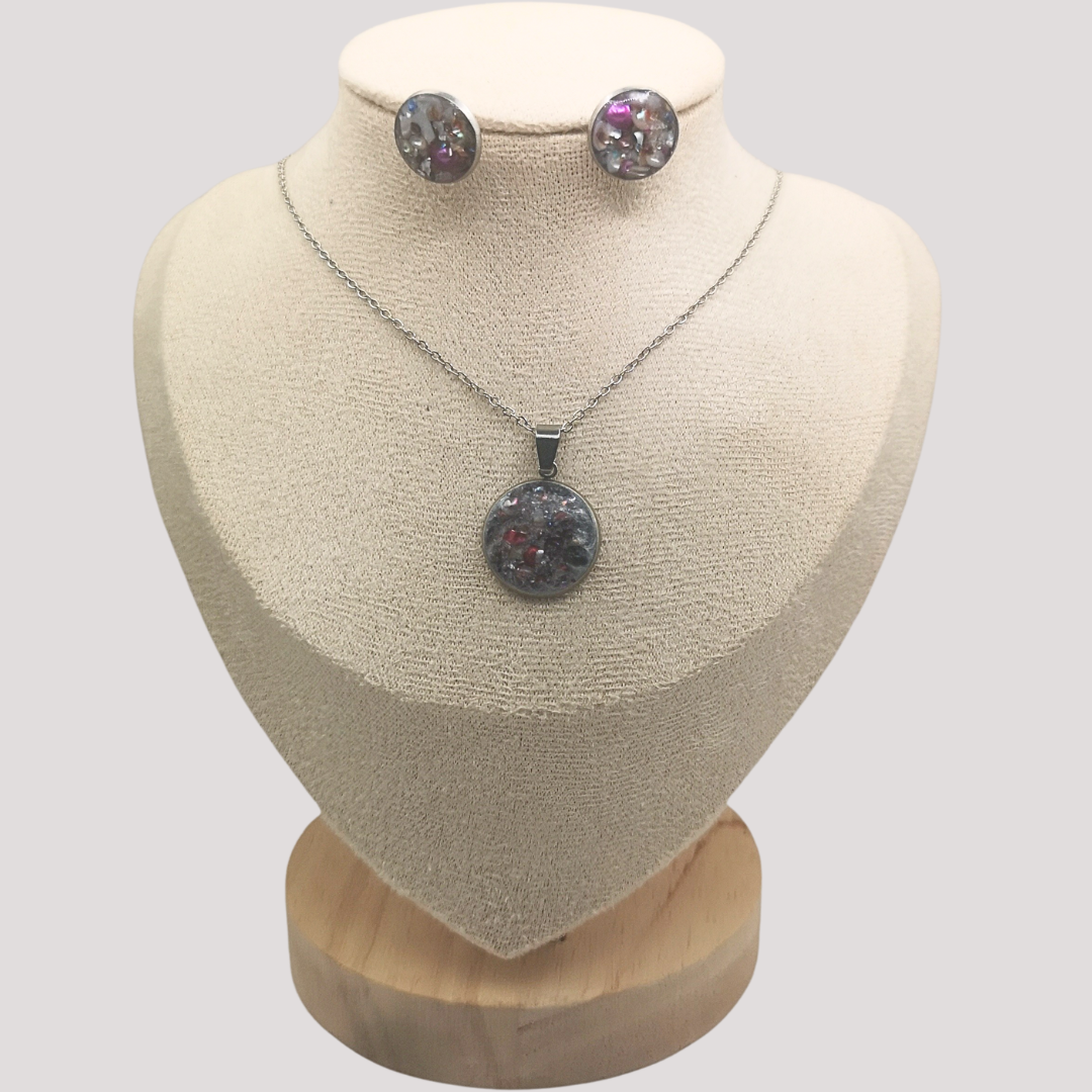 Crushed freshwater pearls Jewelry set with necklace and earrings on a mannequin bust against a plain background