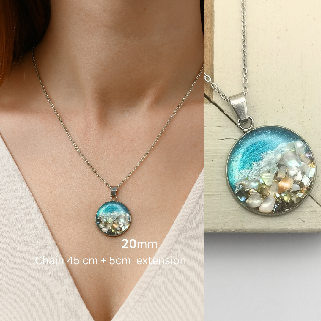 Necklace with a round pendant featuring a scenic design, displayed on a mannequin and close-up.