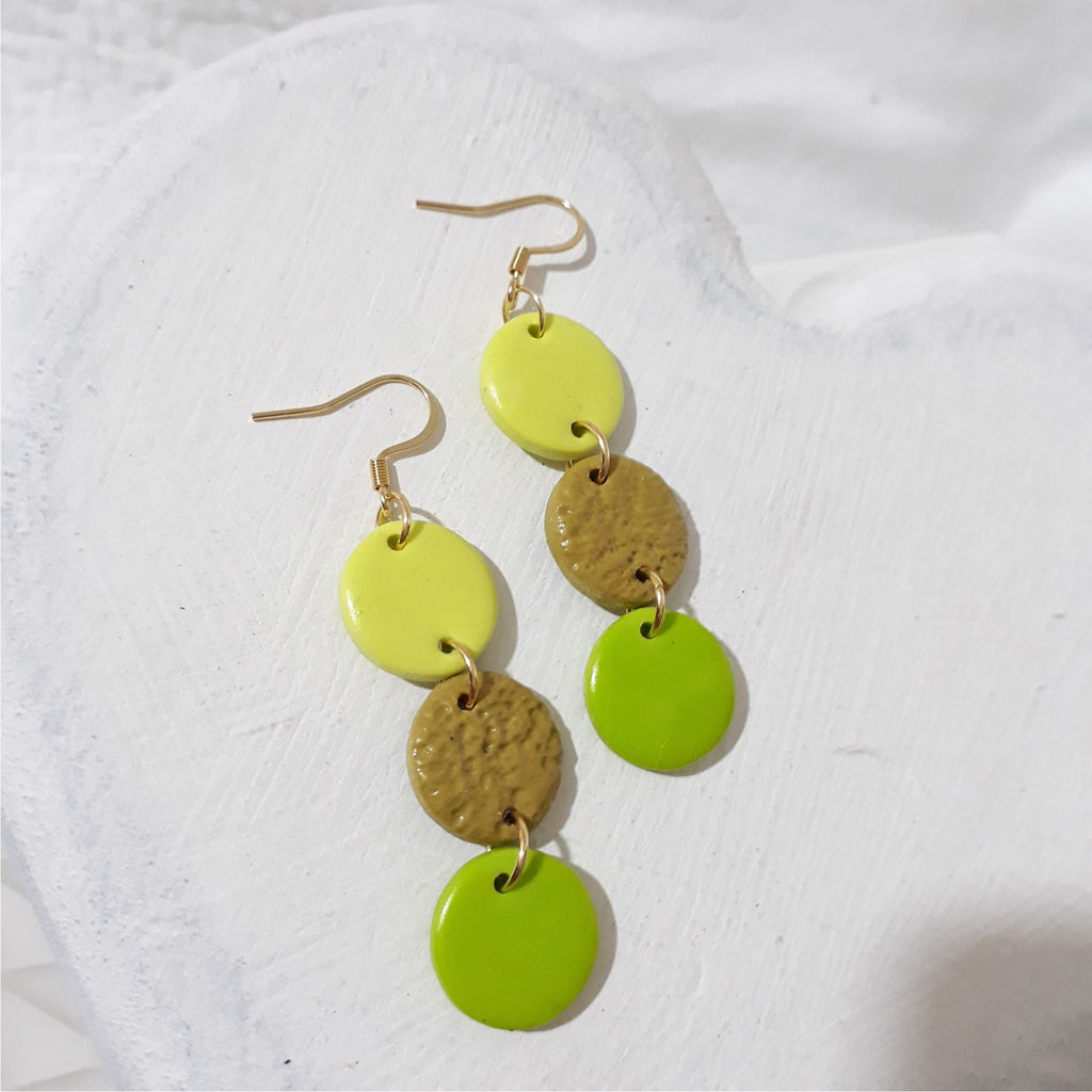 Lemon yellow, mustard and lime green polymer clay cascade earrings.