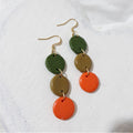 Moss green, olive and orange three-circle polymer clay cascade earrings with gold-plated shepherd hooks.