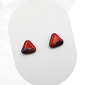 Pair of red triangular earrings on a white background