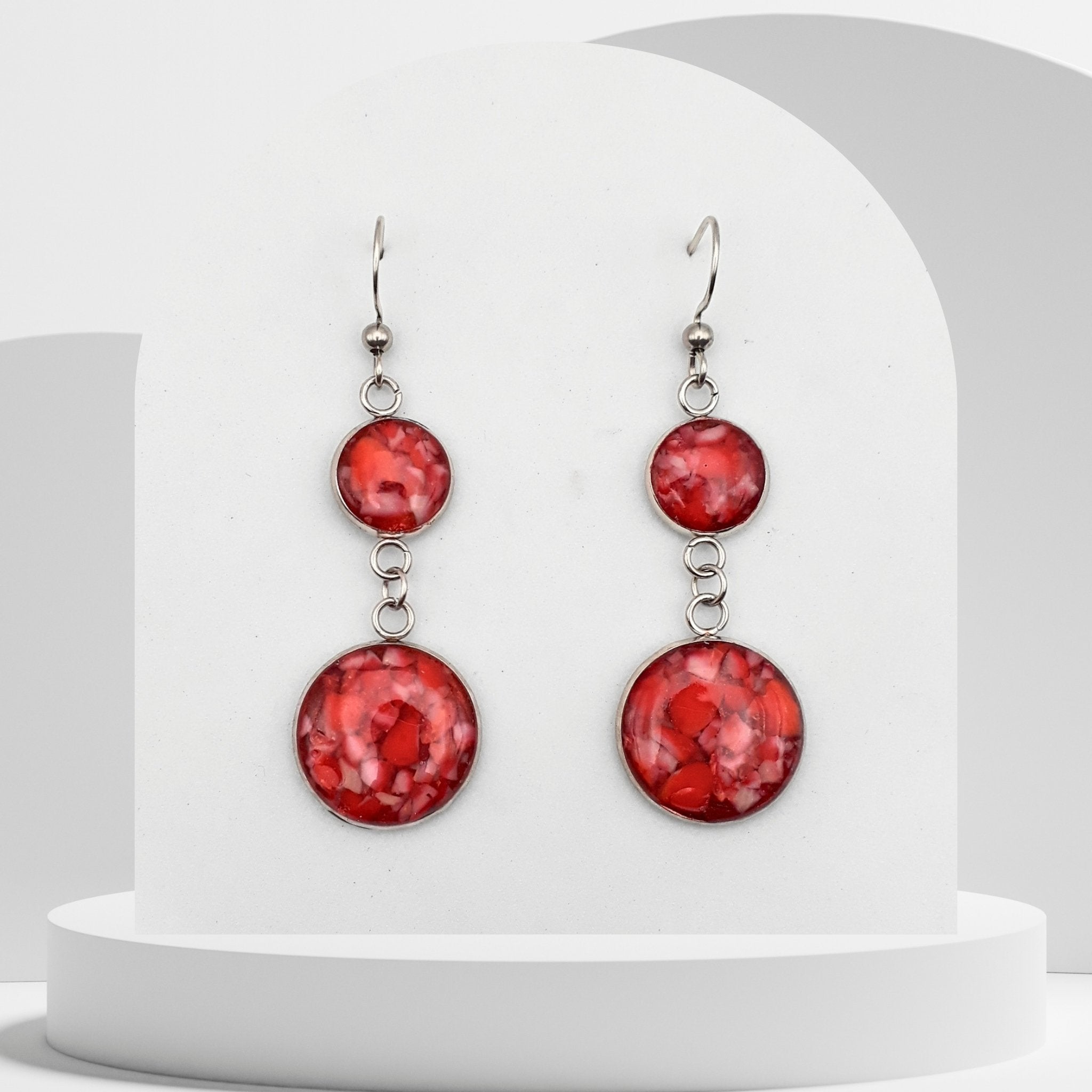 4cm stainless steel dangle earrings with 10mm and 16mm bezels filled with crushed natural red coral sealed in glossy resin