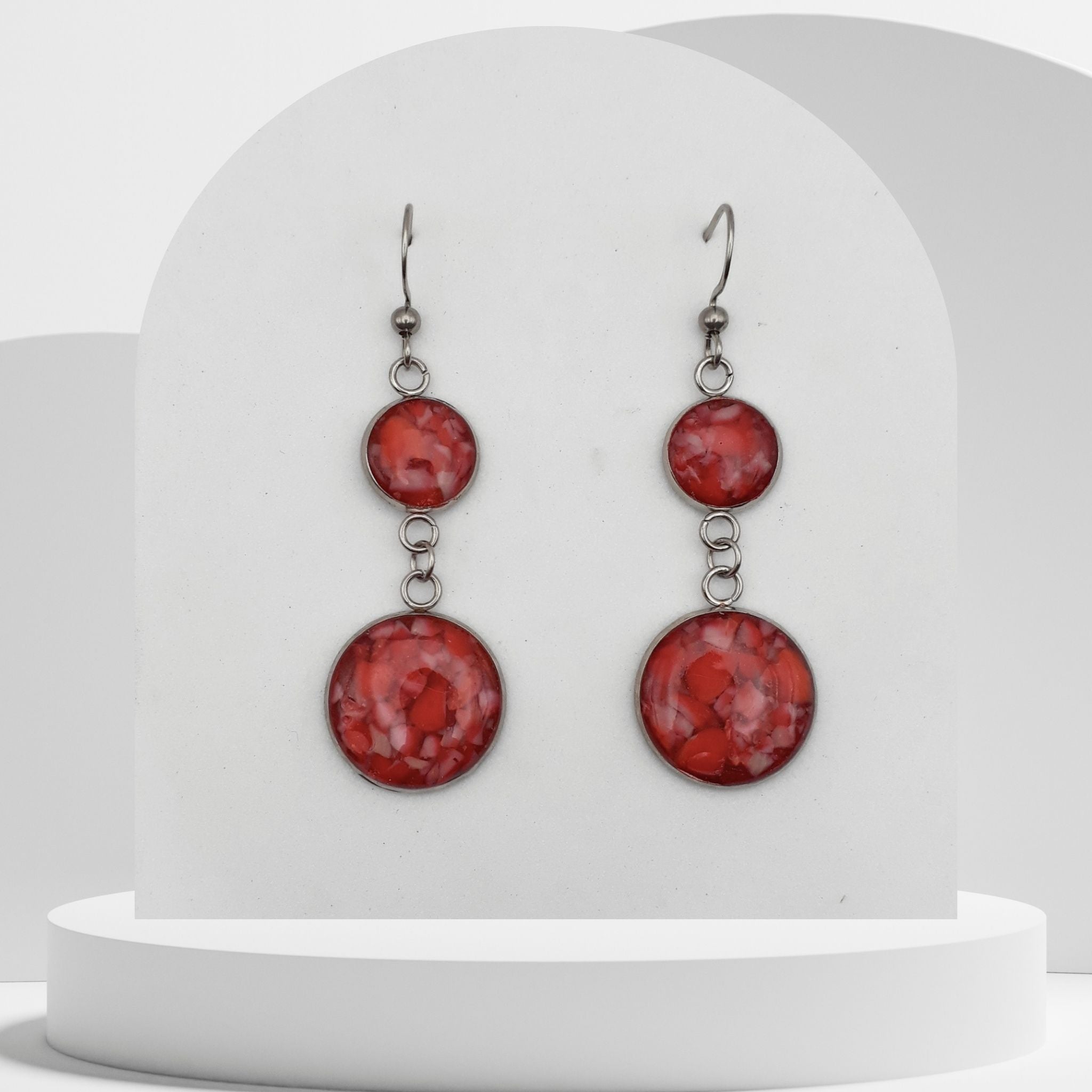 4cm stainless steel dangle earrings with 10mm and 16mm bezels filled with crushed natural red coral sealed in glossy resin