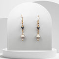 Freshwater Pearl gold‑plated stainless steel earrings with ceramic hearts.