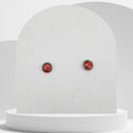 7mm stainless steel stud earrings with crushed natural red coral sealed in glossy resin bezel setting