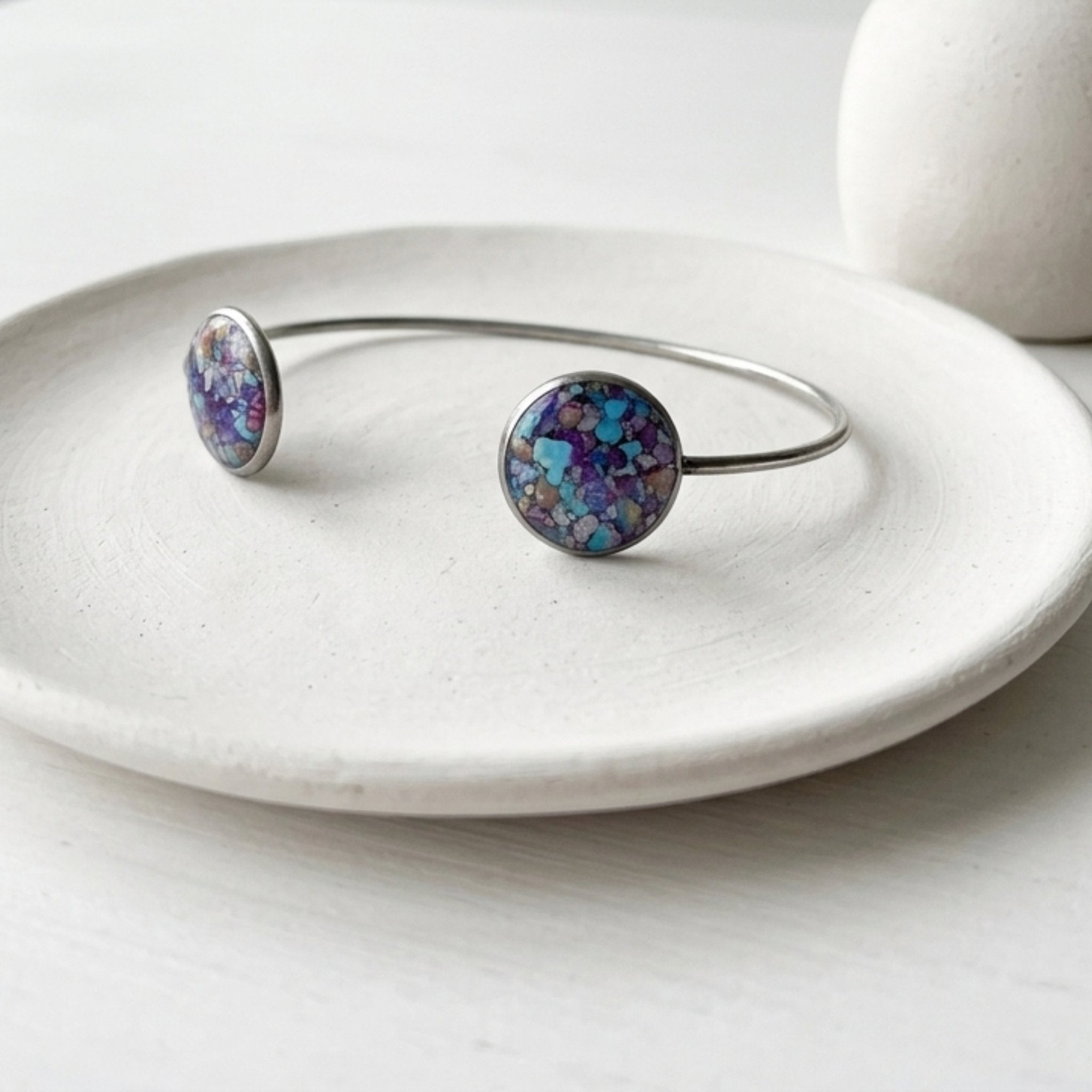 Handmade stainless steel open cuff bangle with crushed Imperial Jasper sealed in resin