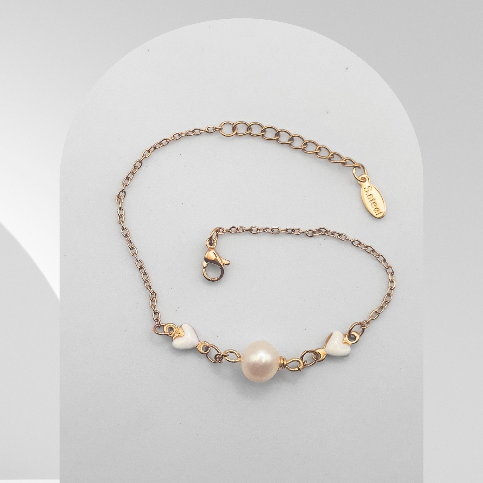 Freshwater pearl gold plated stainless steel bracelet with little hearts