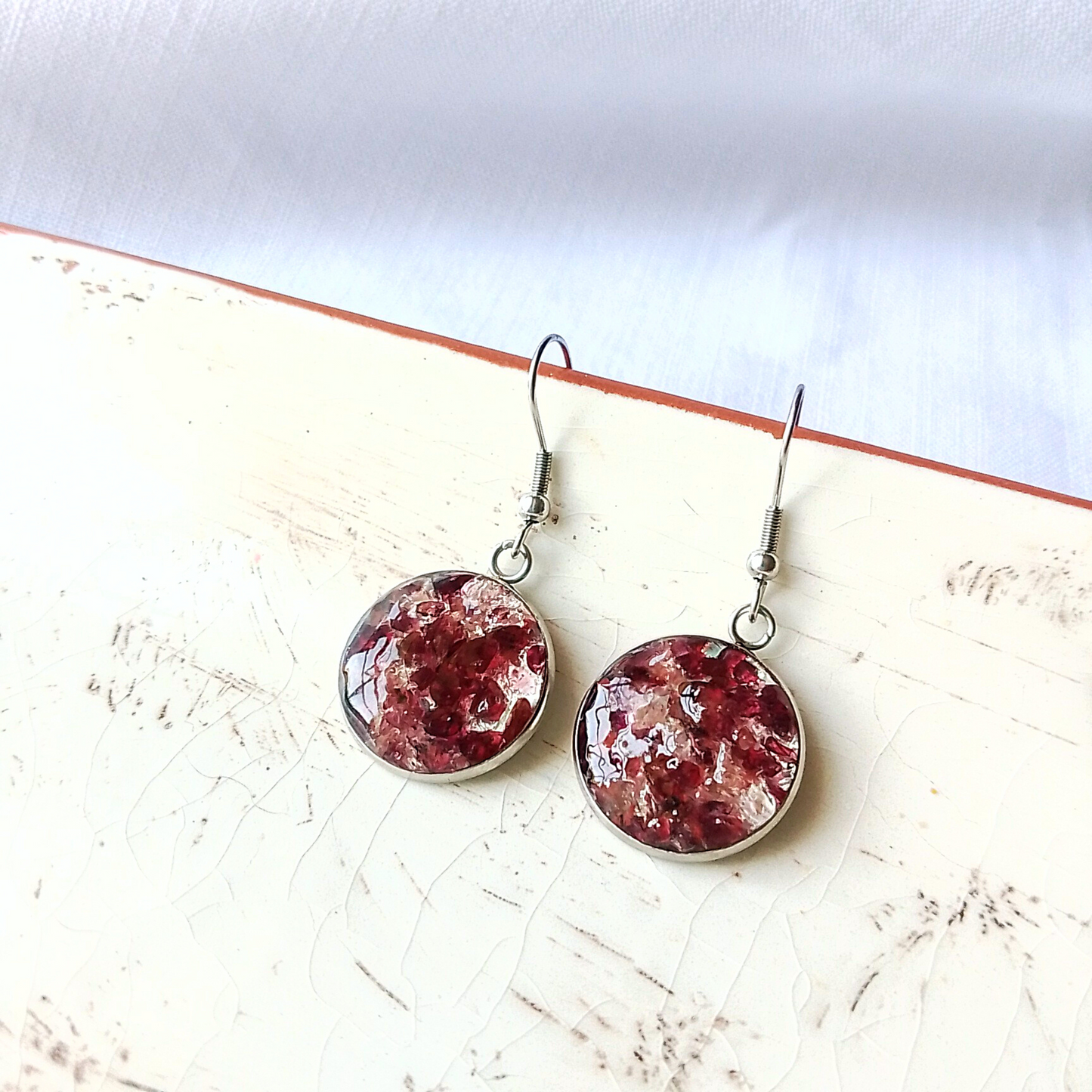 Our exquisite Garnet Birthstone Drop Earrings - designed for those born in January. These unique handmade earrings feature a breathtaking arrangement of garnets set in an 18mm round stainless steel design