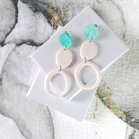 Embrace elegance with our unique handmade white dangle polymer clay earrings, boasting a 60mm drop.