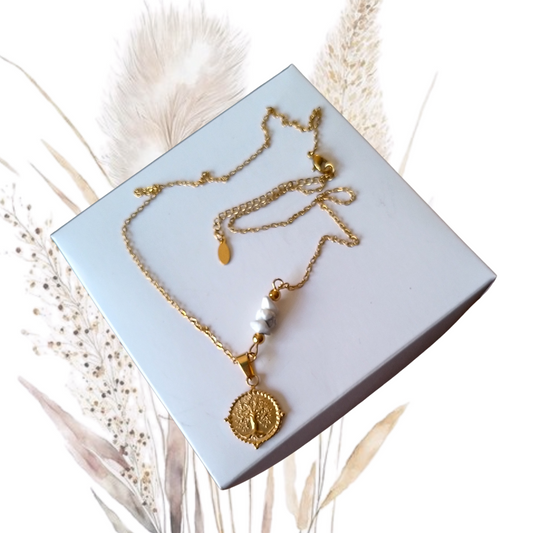 Elevate your neckline with our stunning golden stainless steel necklace with Howlite gemstones and a Tree of life pendant. 
