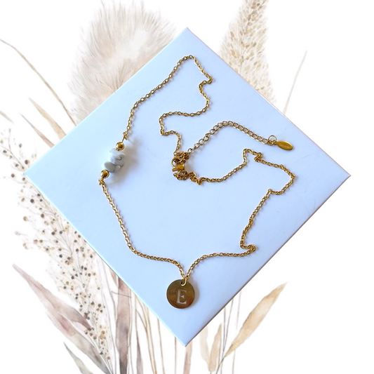 Whether worn alone for a chic minimalist look or layered with other necklaces for a trendy style, this Golden Stainless Steel Necklace with Howlite and a Letter Pendant is a versatile piece that complements any wardrobe.