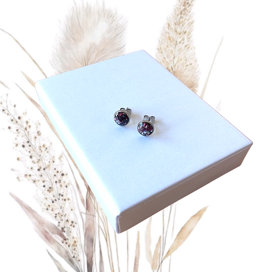 Be inspired with these stunning, handmade freshwater pearl ear studs. Dark purple crushed pearls, set in 7mm stainless steel, will add an elegant touch to any look. 
