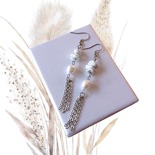 Indulge in elegance with our White Freshwater Pearl and Howlite Dangle Earrings. These handmade beauties exude sophistication and refinement, perfect for any special occasion