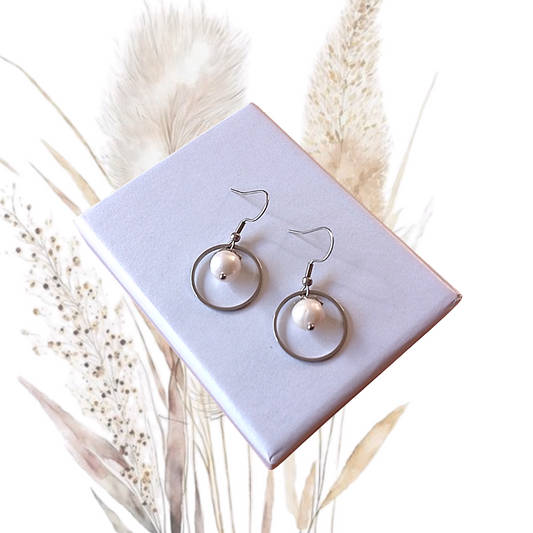 Indulge in effortless elegance with our White Freshwater Pearl Drop Earrings. Handcrafted with care, these earrings feature stainless steel Shepherd Ear Hooks and 4mm pearls.