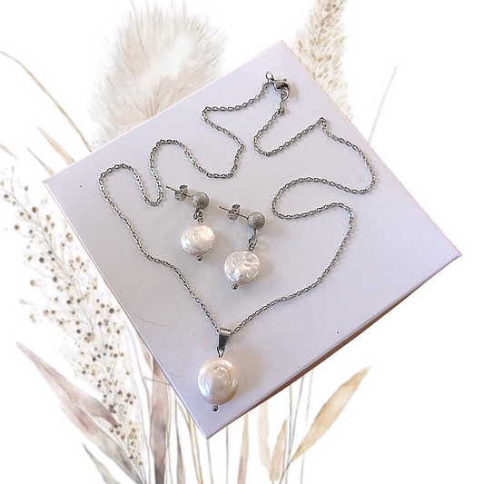 This exquisite White Freshwater Coin Pearl Jewelry Set is the ultimate indulgence for the modern bride-to-be or a perfect gift for someone special.