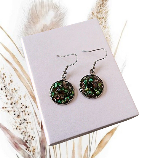 Bring a touch of elegance to your outfit with our handmade Crushed Dark Green Freshwater Pearl Earrings.