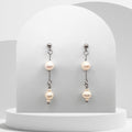 White freshwater pearl dangle earrings.