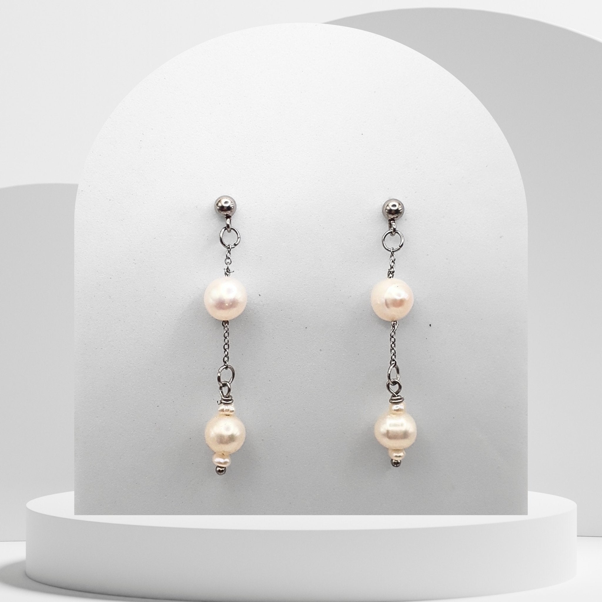 White freshwater pearl dangle earrings.