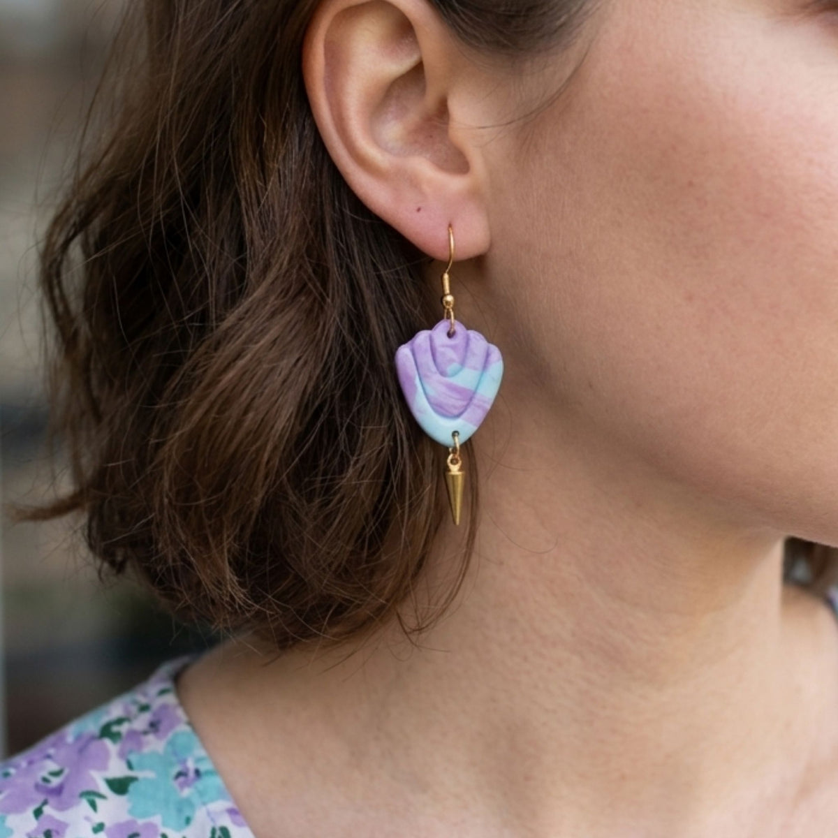 Woman wearing Lilac, Aqua and Lavender Art Deco Clay Earrings with gold plated ear hooks.