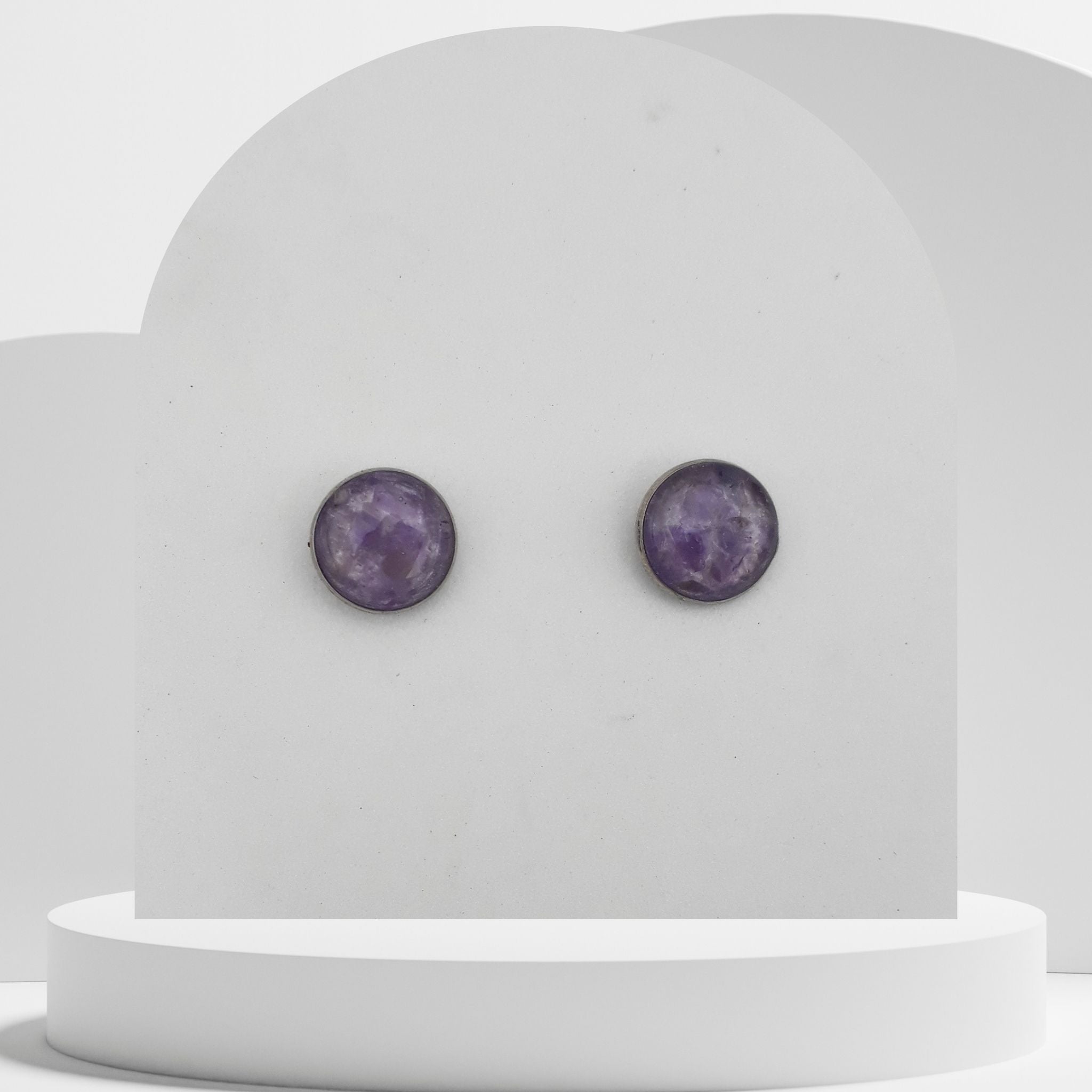 Stainless steel stud earrings with crushed amethyst gemstones in 12mm resin bezel