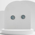 Stainless steel stud earrings with crushed aquamarine gemstones in 10mm resin bezel