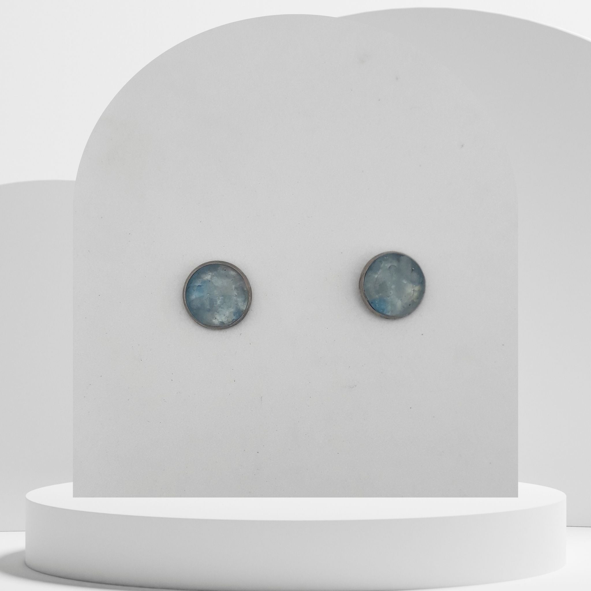 Stainless steel stud earrings with crushed aquamarine gemstones in 10mm resin bezel