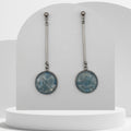 Stainless steel bar dangle earrings with crushed aquamarine gemstone resin discs and ball stud tops