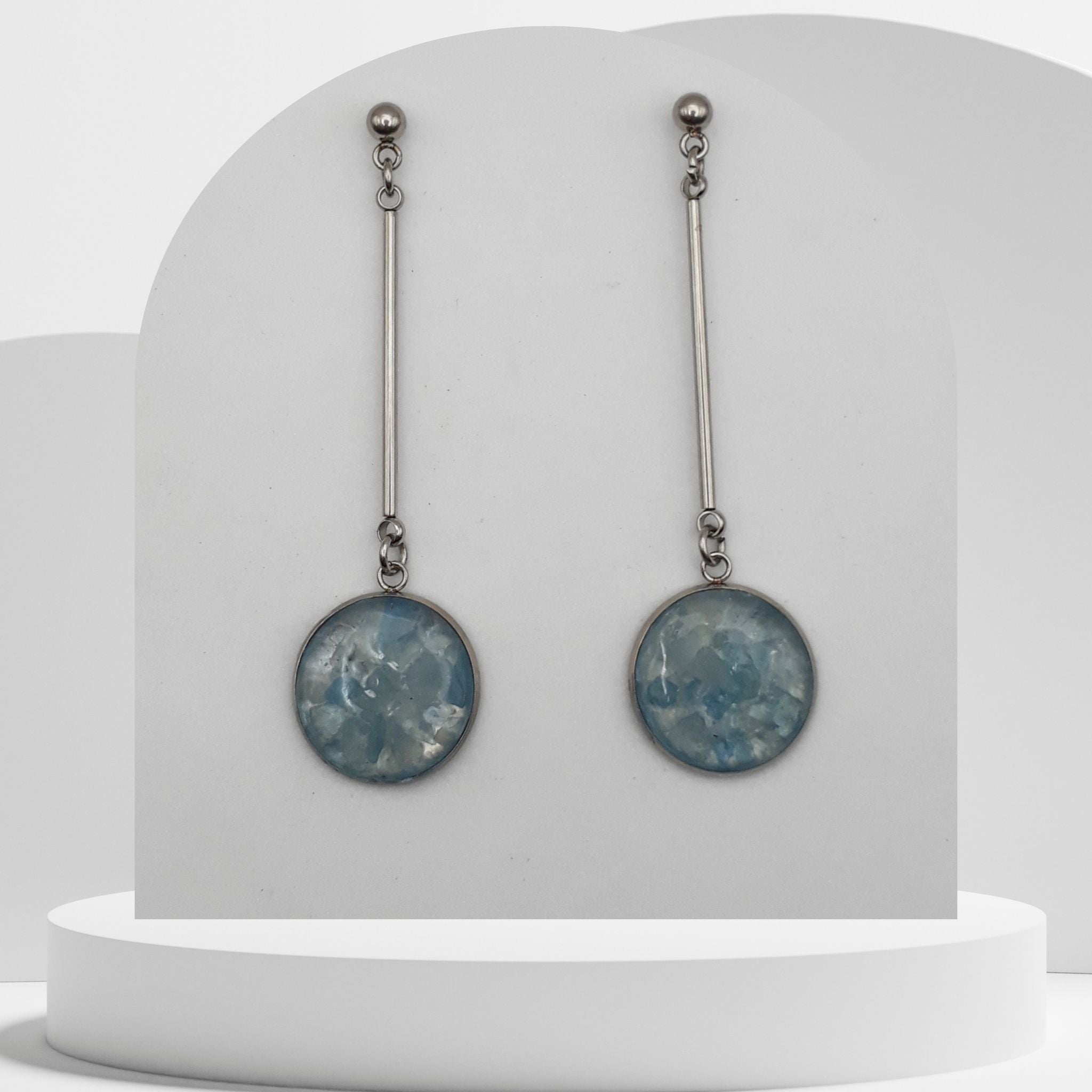 Stainless steel bar dangle earrings with crushed aquamarine gemstone resin discs and ball stud tops
